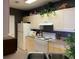 Bright kitchen features a white stove, white cabinets, and a neutral countertop at 3334 Peachtree Ne Rd # 1110, Atlanta, GA 30326