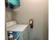 Practical laundry area with washer and dryer, and storage space above at 3334 Peachtree Ne Rd # 1110, Atlanta, GA 30326