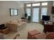 The light-filled living area has a floral sofa, sitting chairs, and natural light at 3334 Peachtree Ne Rd # 1110, Atlanta, GA 30326