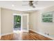 Bedroom featuring hardwood floors and an exterior door leading to a deck space at 2121 Arlington Ne Ave, Atlanta, GA 30324