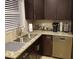Kitchen featuring granite countertops, stainless steel appliances, and dark cabinets at 2121 Arlington Ne Ave, Atlanta, GA 30324