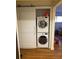 Stacked washer and dryer in laundry space with sliding barn door at 2121 Arlington Ne Ave, Atlanta, GA 30324