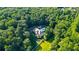 House nestled in the woods with a pool at 2269 E Cherokee Dr, Woodstock, GA 30188