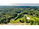 Aerial view of property showing house, land, and pond at 2269 E Cherokee Dr, Woodstock, GA 30188