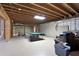 Unfinished basement with exposed beams, ping pong table, and potential for customization at 2269 E Cherokee Dr, Woodstock, GA 30188