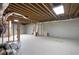 Unfinished basement with exposed beams and a large open space for storage or future development at 2269 E Cherokee Dr, Woodstock, GA 30188