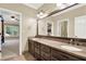 Double vanity bathroom with granite countertops and access to the main bedroom at 2269 E Cherokee Dr, Woodstock, GA 30188