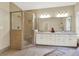 Spa-like bathroom with a double vanity, granite countertops, and a large shower at 2269 E Cherokee Dr, Woodstock, GA 30188