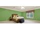 Charming bedroom with green walls, a comfortable bed, and plenty of natural light at 2269 E Cherokee Dr, Woodstock, GA 30188