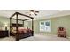 Grand bedroom featuring a large four poster bed and plenty of natural light at 2269 E Cherokee Dr, Woodstock, GA 30188