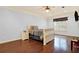 Cozy bedroom with a sleigh bed, hardwood floors, and a window with shutters at 2269 E Cherokee Dr, Woodstock, GA 30188