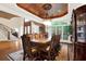 Elegant formal dining room with large table, hardwood floors, and decorative ceiling at 2269 E Cherokee Dr, Woodstock, GA 30188