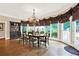 Spacious dining room featuring hardwood floors, a large table, and abundant natural light at 2269 E Cherokee Dr, Woodstock, GA 30188