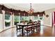 Bright dining room with hardwood floors, large windows, and a beautiful chandelier at 2269 E Cherokee Dr, Woodstock, GA 30188