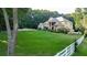 Beautiful home with large backyard and white fence at 2269 E Cherokee Dr, Woodstock, GA 30188