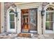 Double front doors open to a spacious foyer at 2269 E Cherokee Dr, Woodstock, GA 30188