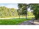 Landscaped yard with a long driveway leading to a gated entrance at 2269 E Cherokee Dr, Woodstock, GA 30188