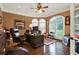 Home office with built-in desk and hardwood floors at 2269 E Cherokee Dr, Woodstock, GA 30188