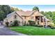 Large two-story house with manicured lawn at 2269 E Cherokee Dr, Woodstock, GA 30188