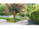 Landscaped walkway with flowering crape myrtle at 2269 E Cherokee Dr, Woodstock, GA 30188