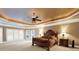 Spacious main bedroom with hardwood floors, large windows, and a ceiling fan at 2269 E Cherokee Dr, Woodstock, GA 30188