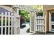White gate opens to a tranquil pool area at 2269 E Cherokee Dr, Woodstock, GA 30188