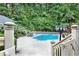 Inviting in-ground pool with surrounding patio at 2269 E Cherokee Dr, Woodstock, GA 30188