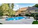 Inviting pool with lounge chairs, surrounded by lush landscaping and a large home at 2269 E Cherokee Dr, Woodstock, GA 30188