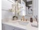 Elegant bathroom with a quartz vanity and gold fixtures at 3315 Stillwood Ln, Atlanta, GA 30354