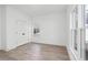 Bright bedroom with hardwood floors, large windows, and double door closet at 3315 Stillwood Ln, Atlanta, GA 30354
