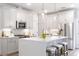 Spacious kitchen featuring white cabinets, quartz countertops, and stainless steel appliances at 3315 Stillwood Ln, Atlanta, GA 30354