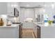 Modern kitchen with white cabinets, quartz countertops and island at 3315 Stillwood Ln, Atlanta, GA 30354
