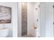 Walk-in shower with gray and white chevron tile and built-in seat at 3315 Stillwood Ln, Atlanta, GA 30354