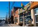 Image shows a brick street with various storefronts, including a brewery at 3315 Stillwood Ln, Atlanta, GA 30354