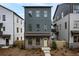 Charming new construction home with a brick foundation and a stylish yellow front door at 3318 Stillwood Ln, Atlanta, GA 30354