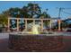 Picturesque fountain with string lights provides a focal point in the community gathering place at 3318 Stillwood Ln, Atlanta, GA 30354