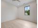Empty bedroom with a large window offering views at 8200 Main St # 1206, Woodstock, GA 30188