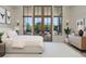 Bright bedroom featuring large windows, a comfortable bed, and stylish decor for a relaxing atmosphere at 8200 Main St # 1206, Woodstock, GA 30188
