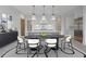 Elegant dining room featuring a modern table, chairs, and stylish lighting at 8200 Main St # 1206, Woodstock, GA 30188