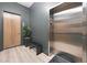 Entrance to the elevator area with sleek elevator doors, modern lighting, and stylish decor at 8200 Main St # 1206, Woodstock, GA 30188