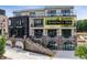 Modern condo building with brick facade and many windows, conveniently located near shops and restaurants at 8200 Main St # 1206, Woodstock, GA 30188