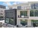 Exterior view of a modern building with balconies and large windows at 8200 Main St # 1206, Woodstock, GA 30188