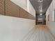 Hallway with sleek design elements, including wood accents and modern lighting at 8200 Main St # 1206, Woodstock, GA 30188
