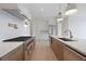 The gourmet kitchen features stainless steel appliances, quartz countertops, and custom cabinets at 8200 Main St # 1206, Woodstock, GA 30188