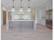 Open-concept kitchen with a large island, stainless steel appliances, and ample cabinet space at 8200 Main St # 1206, Woodstock, GA 30188