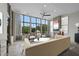 Bright living room featuring a fireplace, large windows, and comfortable seating at 8200 Main St # 1206, Woodstock, GA 30188