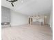 Spacious living room featuring a modern fireplace, open floor plan, and modern lighting fixtures at 8200 Main St # 1206, Woodstock, GA 30188
