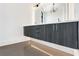 Bathroom featuring gray tile floors, floating double vanity, and modern lighting fixtures at 8200 Main S St # 1208, Woodstock, GA 30188