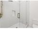 Contemporary bathroom features a glass-enclosed shower with white tile, and modern fixtures at 8200 Main S St # 1208, Woodstock, GA 30188