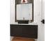 Small bathroom with modern vanity, dark wood cabinets, black sink, and stylish fixtures at 8200 Main S St # 1208, Woodstock, GA 30188